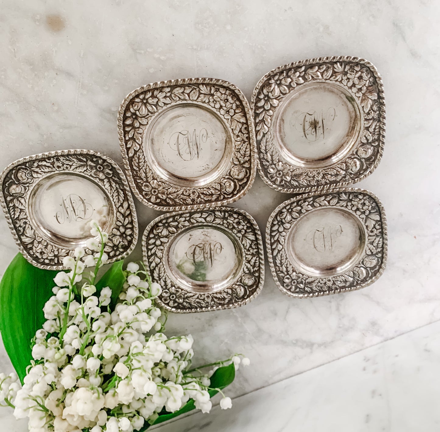 Antique Individual Butter Dishes with Floral Repoussé Border – Set of 5 (c. 1890–1915)