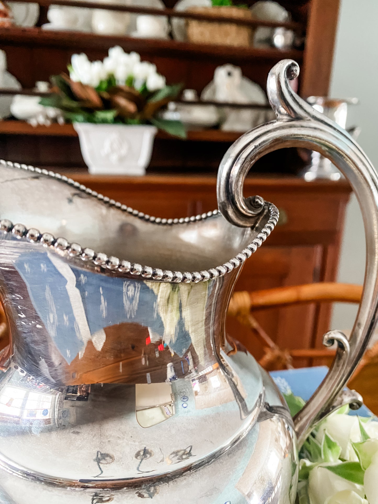 Early 1900s Silver-Plated Pitcher with Regal Lion’s Claw Feet & Ornate Handle