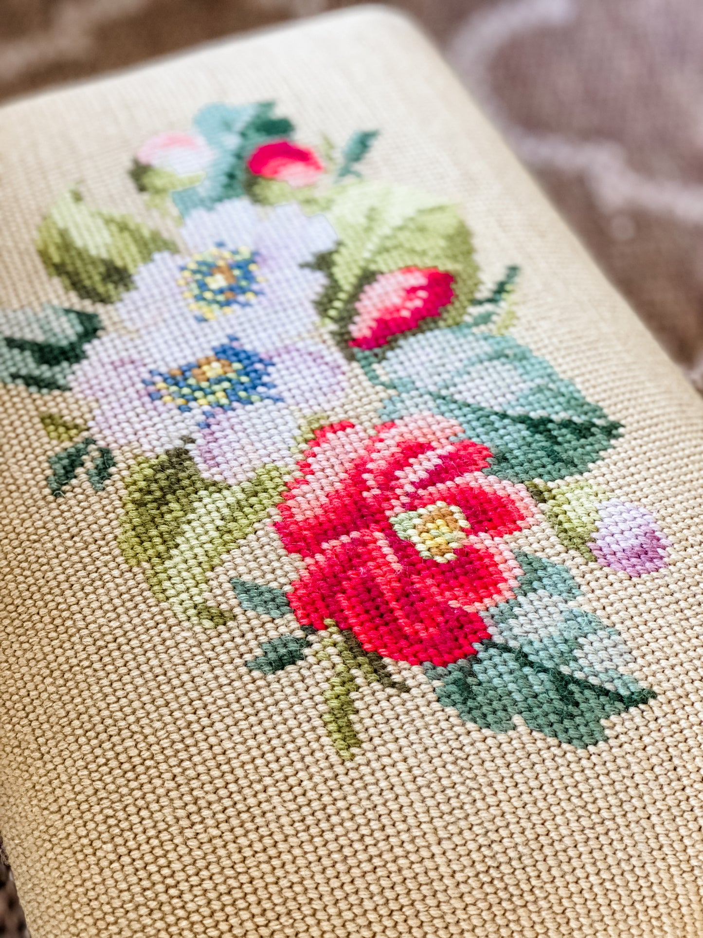 Antique Needlepoint Footstool with Vibrant Floral Design