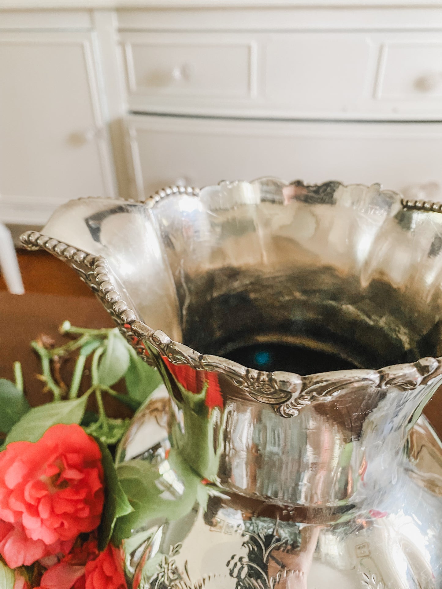 Ornate Antique Pitcher by Pool