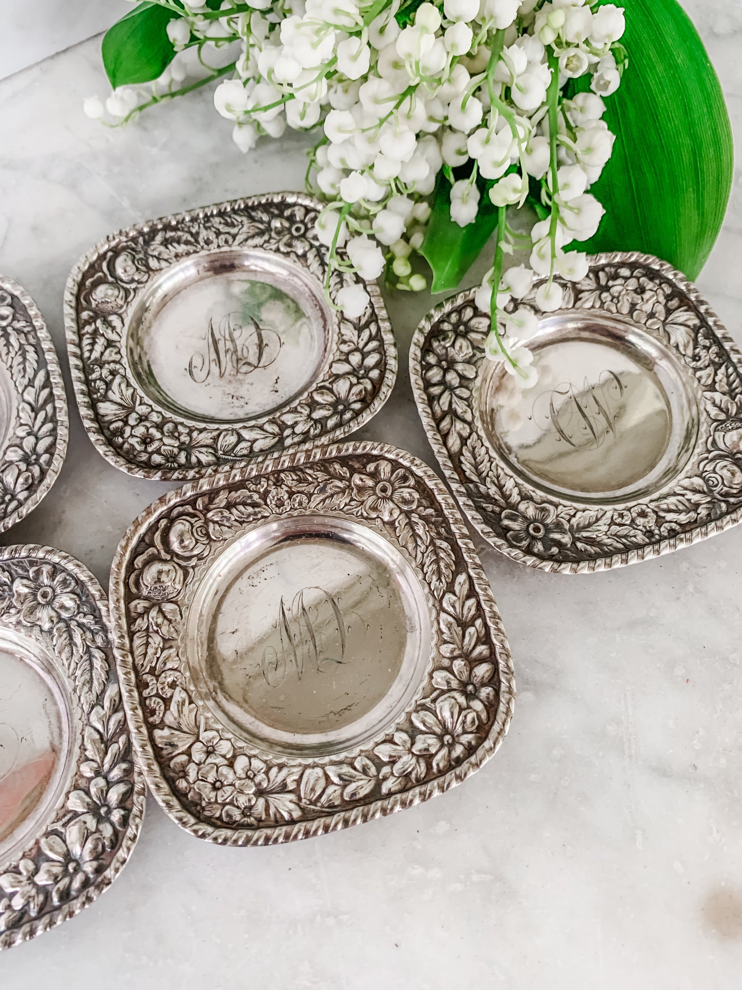 Antique Individual Butter Dishes with Floral Repoussé Border – Set of 5 (c. 1890–1915)