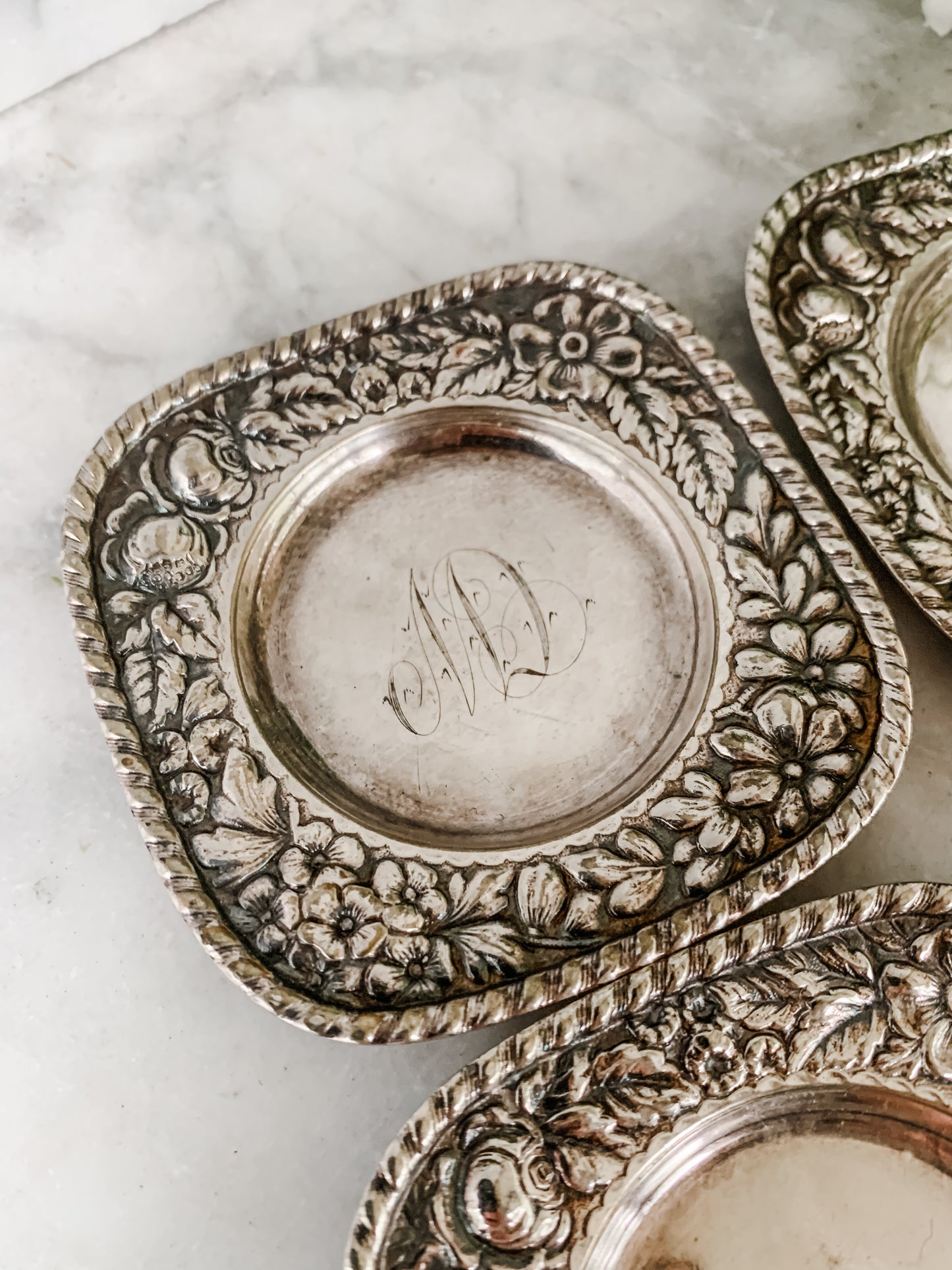 Antique Individual Butter Dishes with Floral Repoussé Border – Set of 5 (c. 1890–1915)
