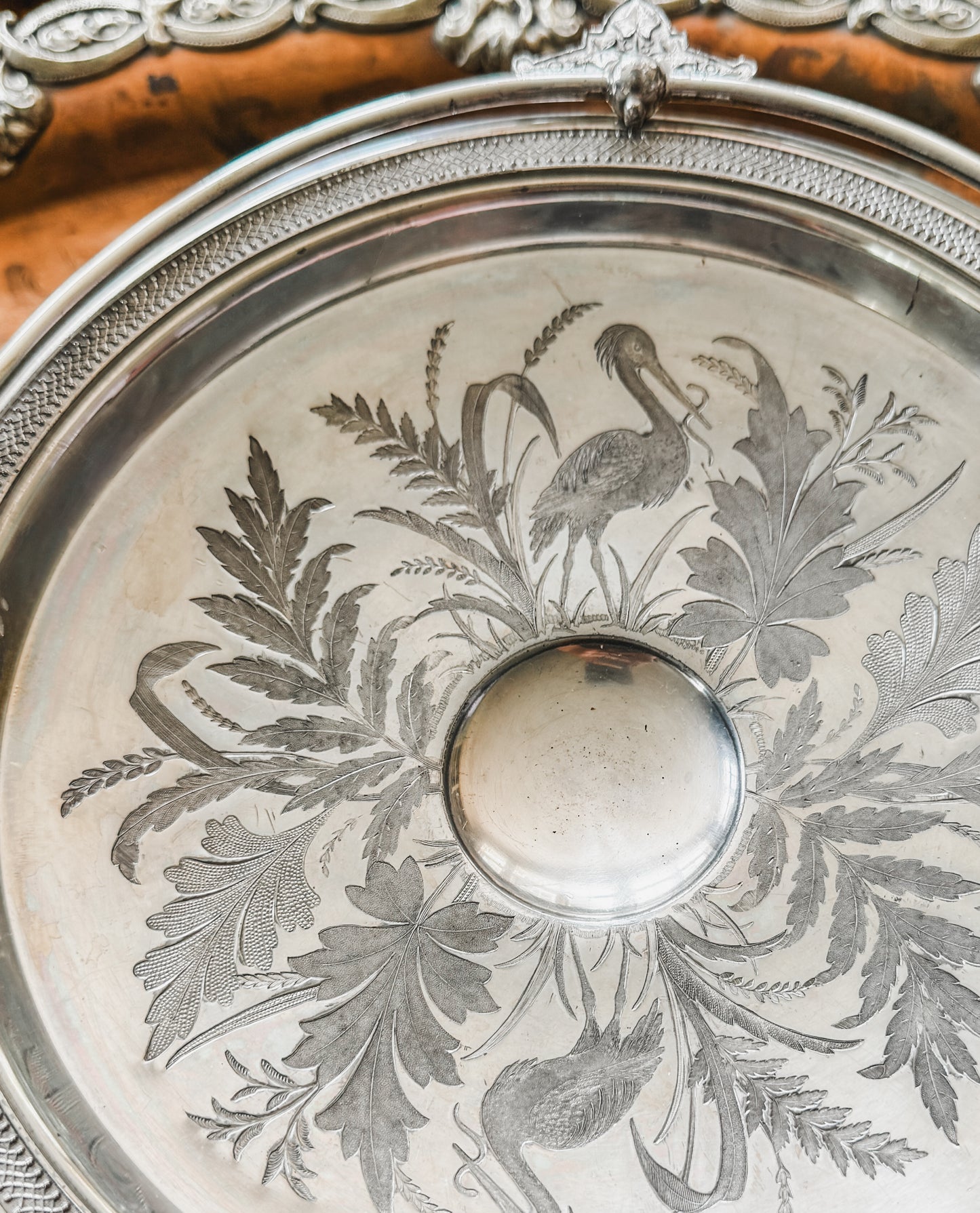 Antique Pedestal Handled Basket adorned with Blue Herons